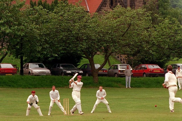 Batter Phil Borrow faces St Chad's bowler Daniel Carboon against the backdrop of St Chad's Church in Headingley.