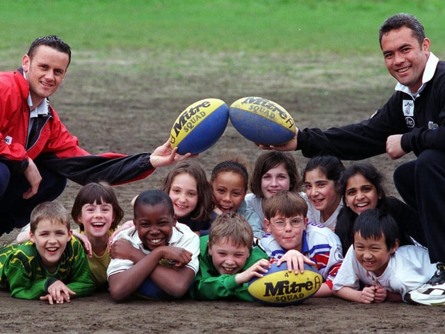 Leeds Rhinos stars Francis Cummins (left) and Martin Masella, coach children from Kirkstall Valley Primary School at Headingley.