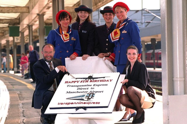 The Transpennine Express rail link service from Leeds City Station to Manchester Airport was celebrating its fifth birthday. Pictured is Transpennine Express commercial manager David Judson with colleague Danielle Houghton and air hostesses from BA and Britannia.