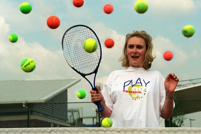 YTV weather girl Debbie Lindley takes evasive action at the launch of Play Tennis 98 at South Leeds Tennis Centre in Middleton.