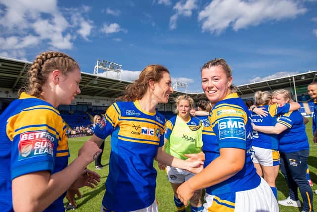 Orla McCallion, right, celebrates Rhinos' semi-final win over York with captain Courtney Winfield-Hill, middle and Tasha Gaines. Picture by Garry Beevers/Leeds Rhinos.