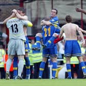 SAFE: Leeds United celebrate their brilliant 3-2 success at Arsenal of May 2003 which ensured Premier League survival with a game to go. Picture by Varleys.