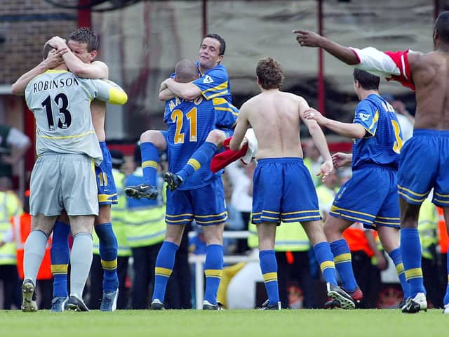 SAFE: Leeds United celebrate their brilliant 3-2 success at Arsenal of May 2003 which ensured Premier League survival with a game to go. Picture by Varleys.