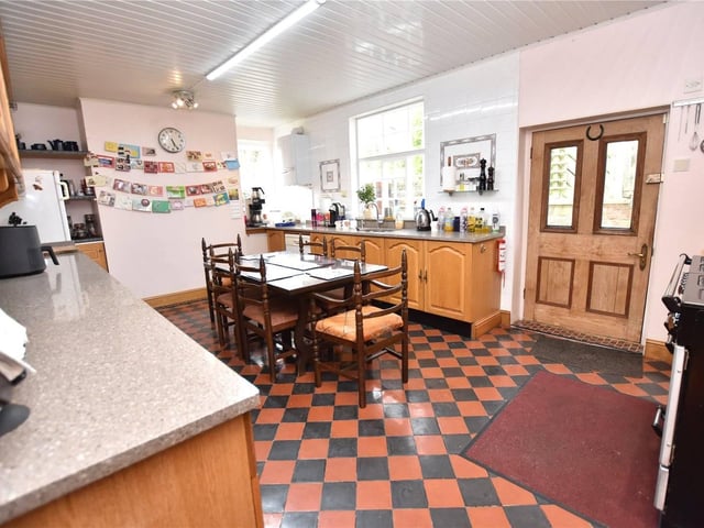 The kitchen is the heart of the home. The generous room has quartz work surfaces, sink with waste disposal unit, and a gas range with extractor hood over.