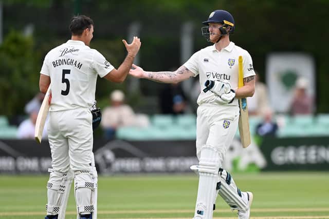 CRASH, BANG, WALLOP: Ben Stokes shakes hands with team-mate David Bedingham on his way to scoring the fastest century in Durham's history at New Road on Friday. Picture: Gareth Copley/Getty Images