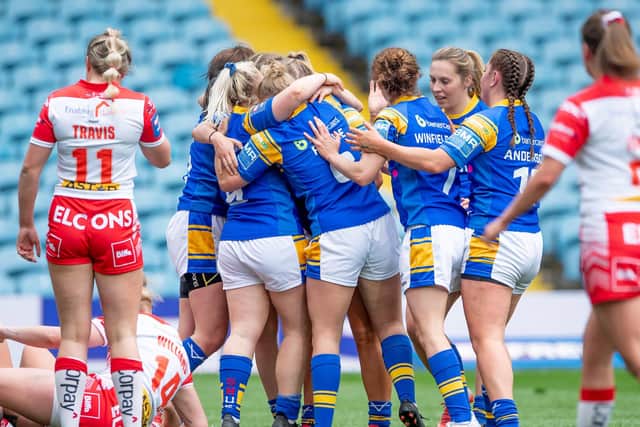 Zoe Hornby is congratulated by her Leeds Rhinos team-mates after scoring her try against St Helens. Picture: Allan McKenzie/SWpix.com.