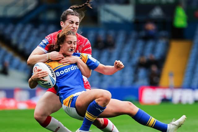 Leeds Rhinos' Fran Goldthorp is tackled by St Helens' Leah Burke. Picture: Alex Whitehead/SWpix.com.
