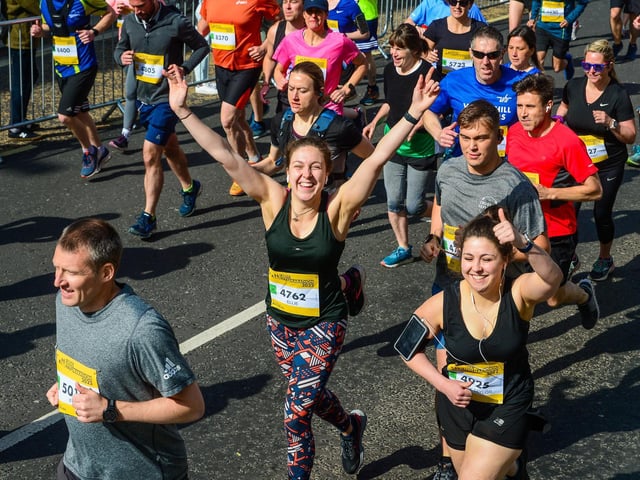 Our photographer gets a big thumbs up from the runners.