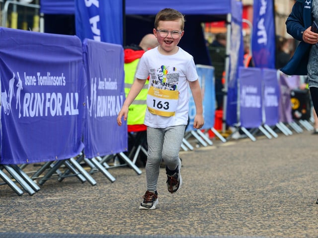 This little man certainly enjoyed the race with his big beaming smile!