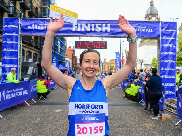 Pictured is the first woman to cross the winning line Aisling Wall.