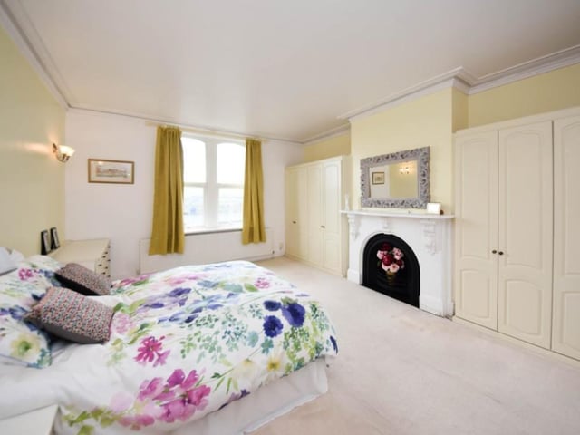 This double bedroom has a Victorian style fireplace and again, benefits from light pouring through the sizeable windows.