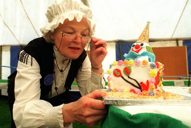 Otley Show steward Nora Hawkins admires  one of the novelty cakes in May 1996.