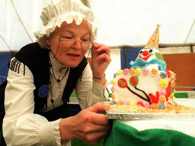 Otley Show steward Nora Hawkins admires  one of the novelty cakes in May 1996.