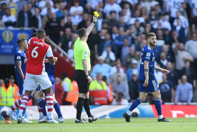 Matuesz Klich is shown a yellow card at the Emirates. Pic: Mike Hewitt.