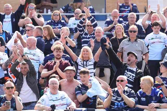 Featherstone Rovers fans celebrate their team's 1895 Cup semi-final win over Barrow. Picture: John Clifton/SWpix.com.
