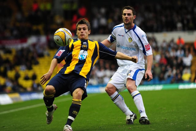 Brighton's Dean Cox (left) clears the ball under pressure from Frazer Richardson.