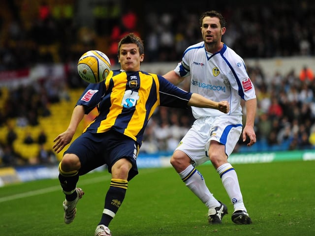 Brighton's Dean Cox (left) clears the ball under pressure from Frazer Richardson.