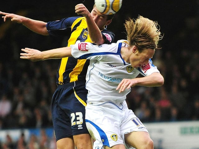 Brighton's Adam Virgo outjumps Luciano Becchio.