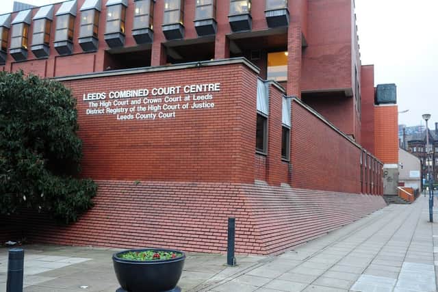 The woman tore the 5cm-long piece from her ex partner's lip, Leeds Crown Court was told