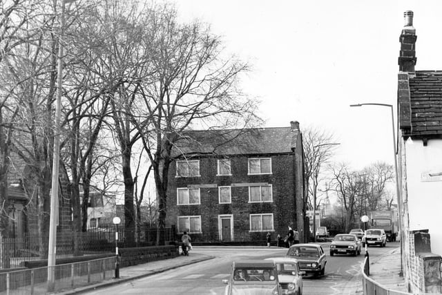 Lower Town Street, showing the junction with Back Lane, leading off to the left in February 1983. In the centre is Town End House, a listed building at no.9 Lower Town Street. Although vacant at the time of the photograph, it was soon to be redeveloped into flats