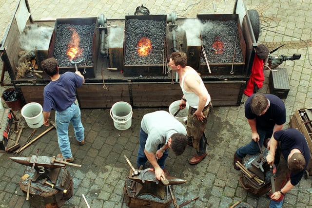 Farriers taking part in a horse shoeing competition held at Tetley's Brewery Wharf.
