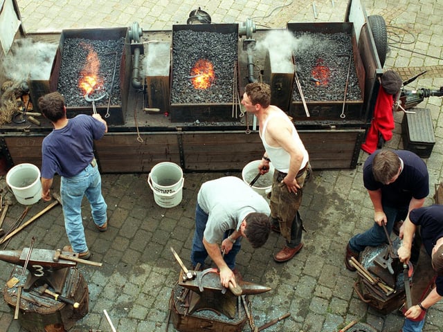 Farriers taking part in a horse shoeing competition held at Tetley's Brewery Wharf.