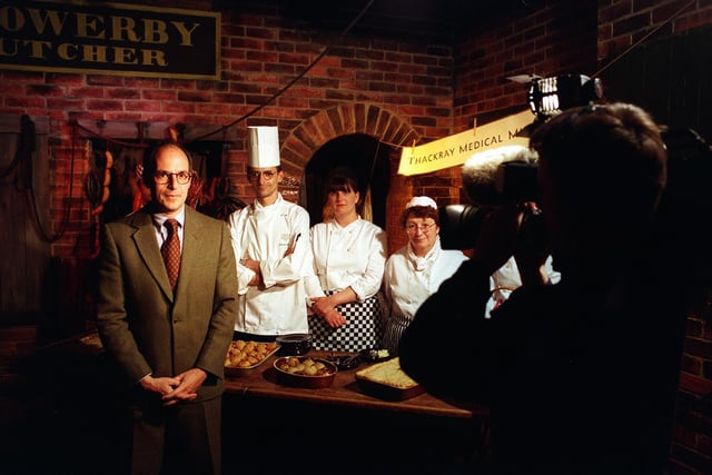 TV's Lloyd Grossman played Oliver Twist at the Thackray Medical Museum 
 during a taste test with real Victorian workhouse food. It was prepared by NVQ kitchen and larder students from Thomas Danby College. He is pictured with, from  left, Lionel Strub, Janine Dixon and Sue Warren as a film crew records the action.