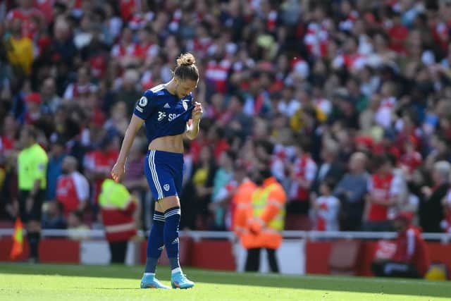 Luke Ayling departs the field at the Emirates after being sent off by referee Chris Kavanagh. Pic: Mike Hewitt.