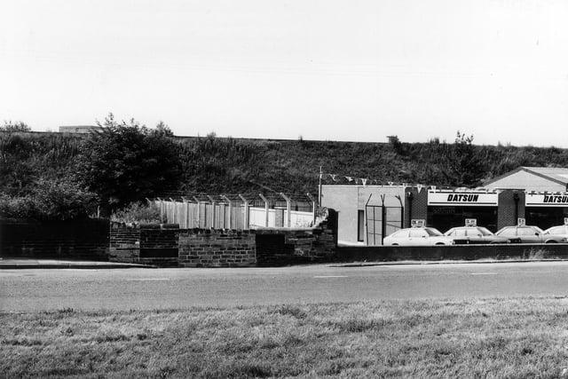 Stanningley Road pictured in July 1983 showing P.K. Motors garage, a Datsun dealer.