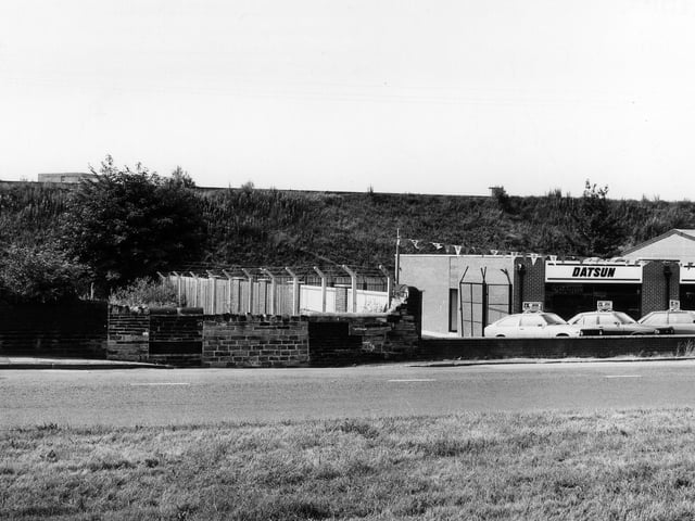 Stanningley Road pictured in July 1983 showing P.K. Motors garage, a Datsun dealer.