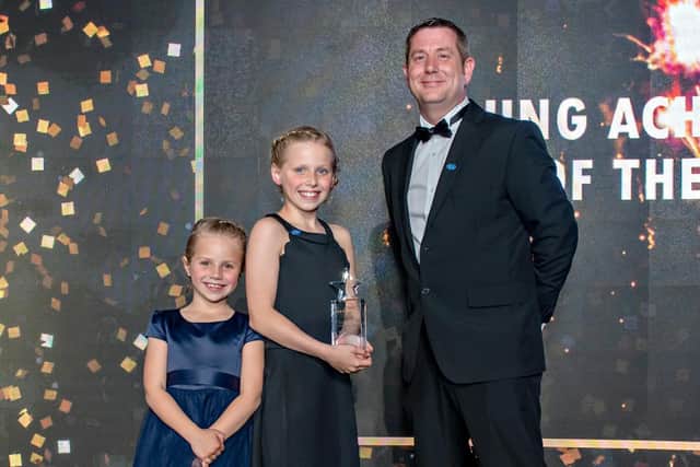 Alan Suttle from Suttle Transport, sponsor of the Young Achiever category, with Macy and Maya Burrow collecting their award. PIC: Ant Robling/Robling Photography