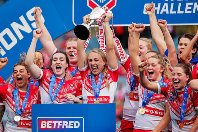 St Helens captain Jodie Cunningham and team-mates celebrate with the Betfred Women's Challenge Cup trophy. Picture: Alex Whitehead/SWpix.com.