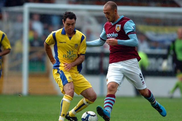 Andy Hughes battles with Burnley's Steven Fletcher during a pre-season clash at Turf Moor in August 2009.
