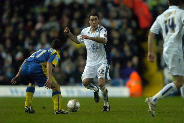 Andrew Hughes looking to pass on the ball in front of Kettering Town's Richie Partridge during the FA Cup round 2 replay at Elland Road in December 2009. Leeds won 5-1 after extra time.
