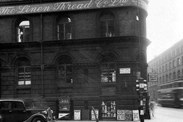 The junction of Wellington Street with King Street in June 1939. Pictured is The Linen Thread Co. Ltd, F.W.Hayes and Co. Ltd., Ainsworth and Sons Ltd., Crawford Bros. Ltd., Dunbar McMaster & Co.Ltd., Robert Stewart & Sons Ltd., North British Boot Co. Ltd.