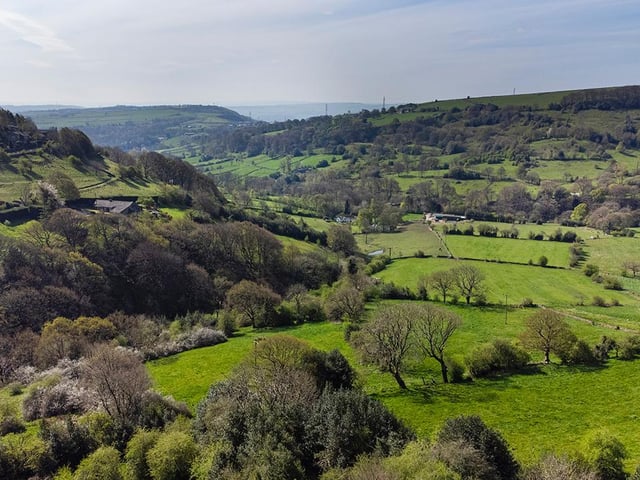 The lush green vista that unfolds before the Shibden property in its elevated location.