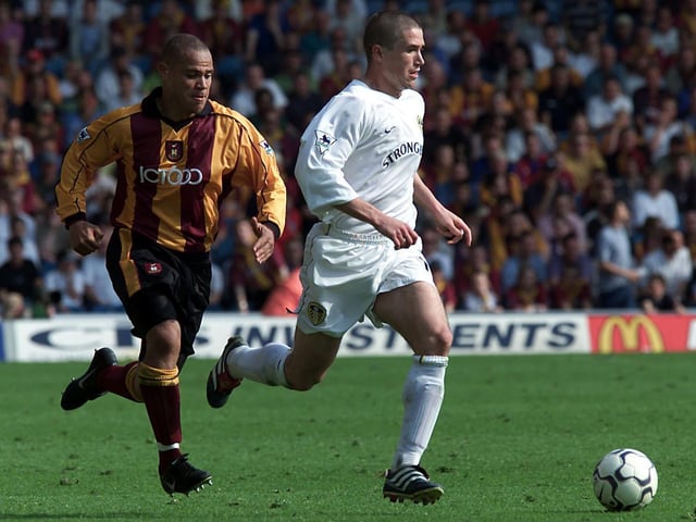 Harry Kewell drives forward ahead of Bradford City's Andy Myers.