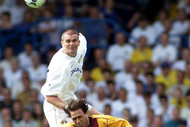 Dominic Matteo rises high to head the ball clear under pressure from Bradford City's Ashley Ward