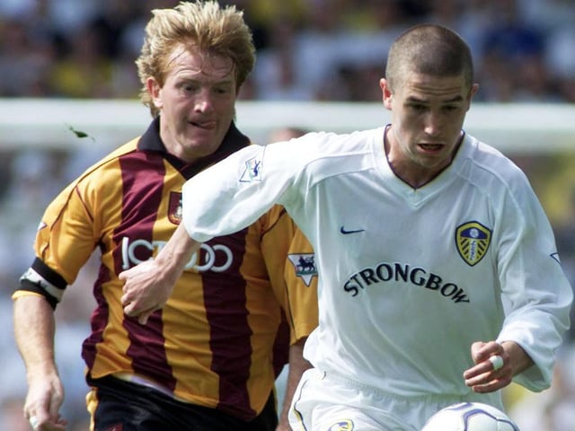 Harry Kewell pulls away from Bradford City captain Stuart McCall.