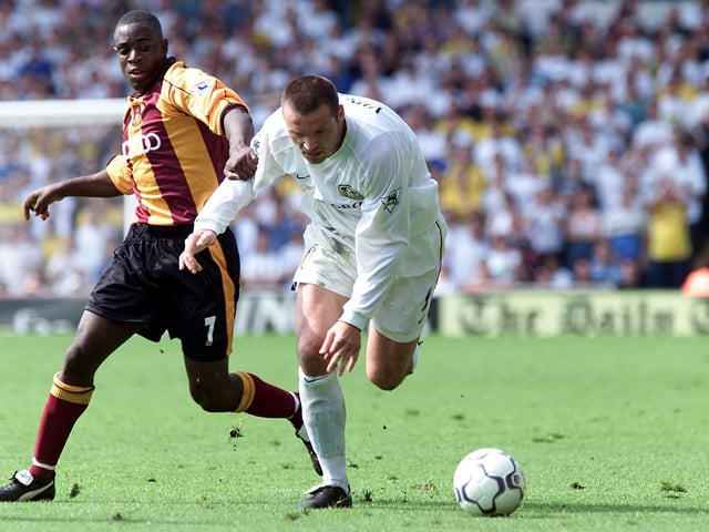 Mark Viduka keeps Bradford City's Jamie Lawrence at bay.