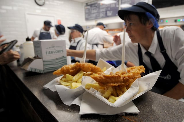 Staff at Fisherman's Wife in Kirkgate Market serve up a portion of fish and chips in September 2019.
