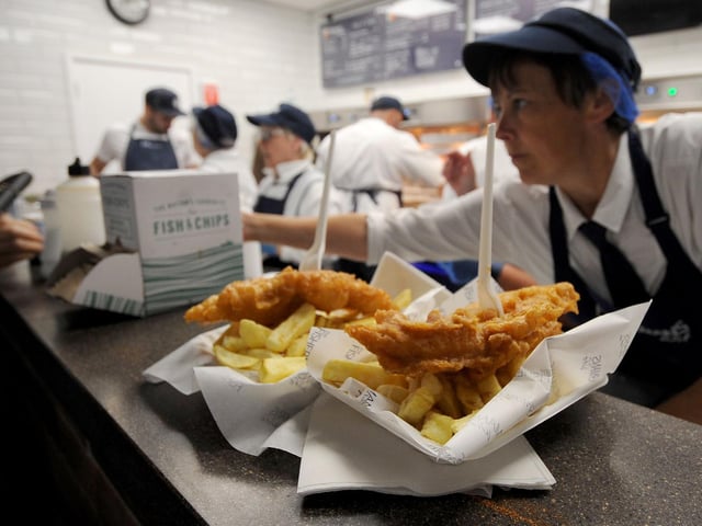 Staff at Fisherman's Wife in Kirkgate Market serve up a portion of fish and chips in September 2019.