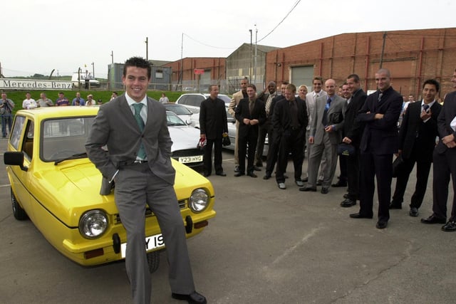 Ian Harte with the yellow Robin Reliant at Elland Road after being voted the week's worst player in training by his teammates.