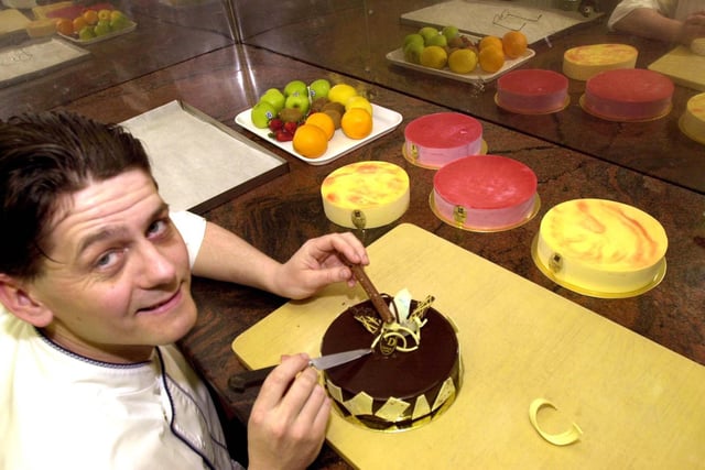 Thierry Dumouchel works on a chocolate cake at his bakery in Garforth in March 2001.