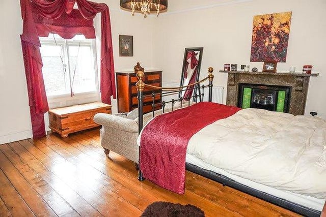 The master bedroom is spacious with plenty of safe and unique wooden floors.