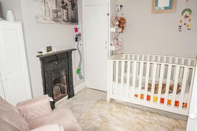 The property features a smaller bedroom perfect for a baby room or office space.