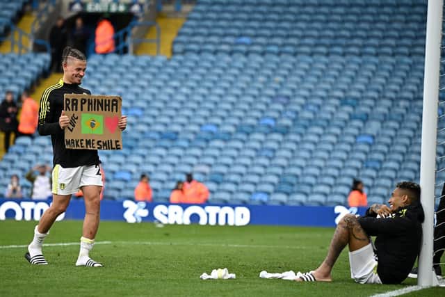 GRIN: Leeds United duo Kalvin Phillips and Raphinha smile following the 1-1 draw with Brighton (Photo by OLI SCARFF/AFP via Getty Images)