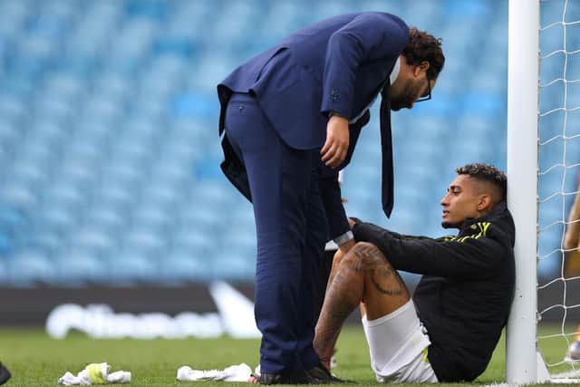 EXCHANGE: Victor Orta and Raphinha chat following Leeds' final home game of the season (Photo by Robbie Jay Barratt - AMA/Getty Images)