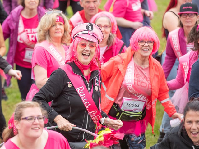 Many of the runners wore bright pink sashes, tutus, hats or wigs.