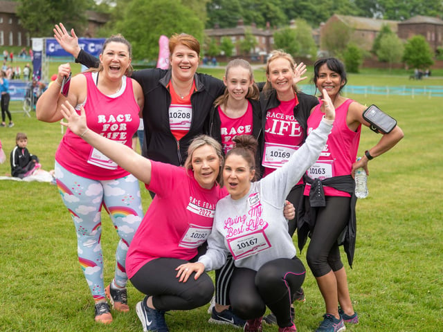 Another team of runners celebrate taking part in the race.
